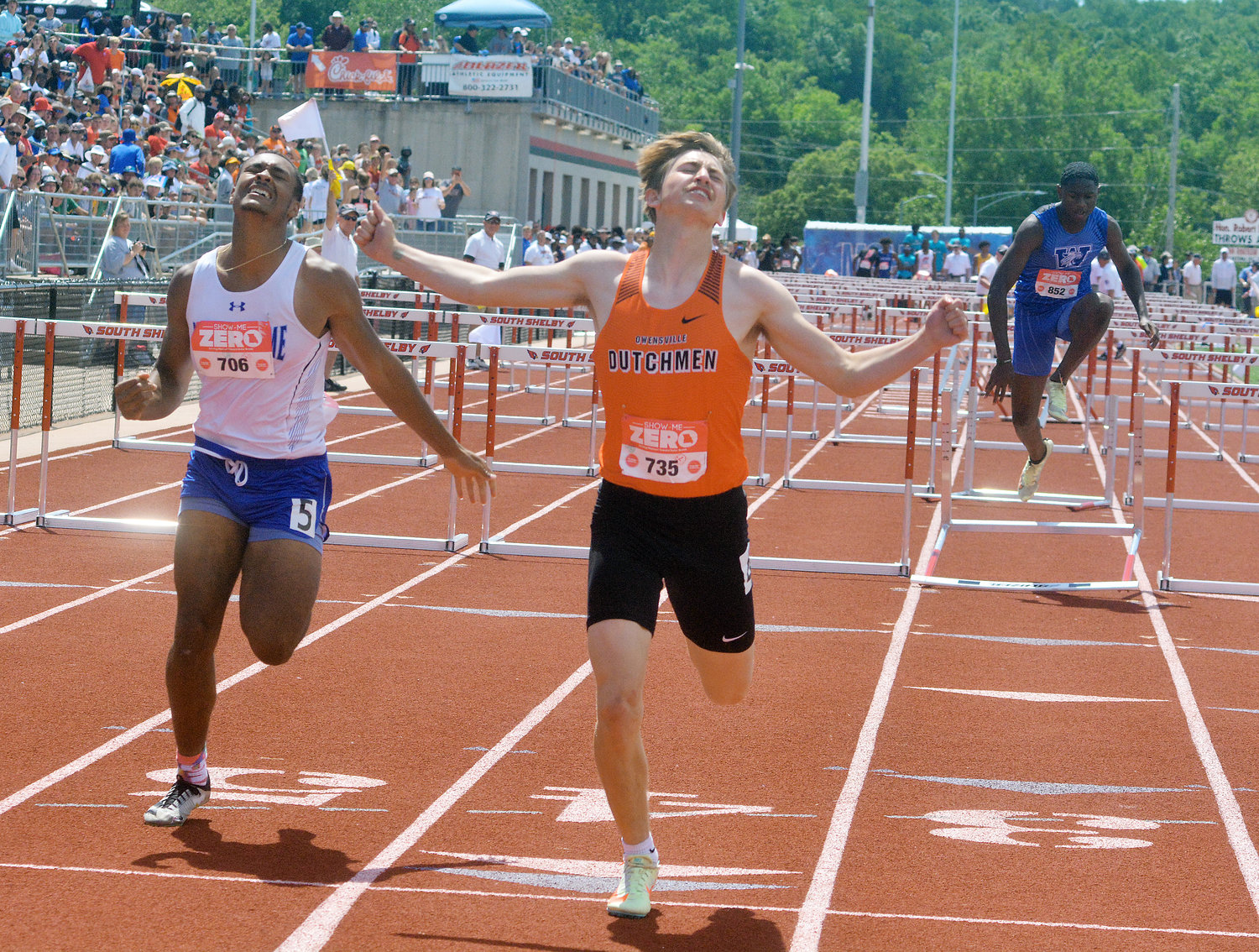 Bryce Payne (center) celebrates his state championship in the Class 3 Boys 110-meter hurdles during the Missouri State High School Activities Association (MSHSAA) State Track and Field Championships held over the weekend at Jefferson City High School’s Dennis and Roberta Licklider Track Complex inside of Adkins Stadium. Payne’s state title is the first individual one for Owensville High School since Bryan Candrl won the pole vault back in 2018.